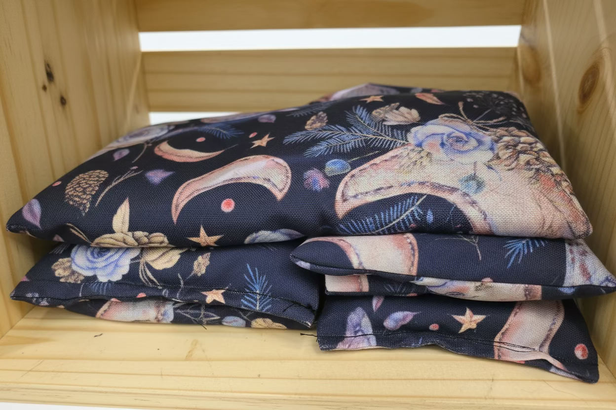 Stack of patterned fabric on a wooden surface